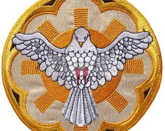 May include: A white dove with red accents, with outstretched wings, is centered on a yellow and gold circular embroidered patch. The dove is surrounded by a sunburst design with a cross in the center.
