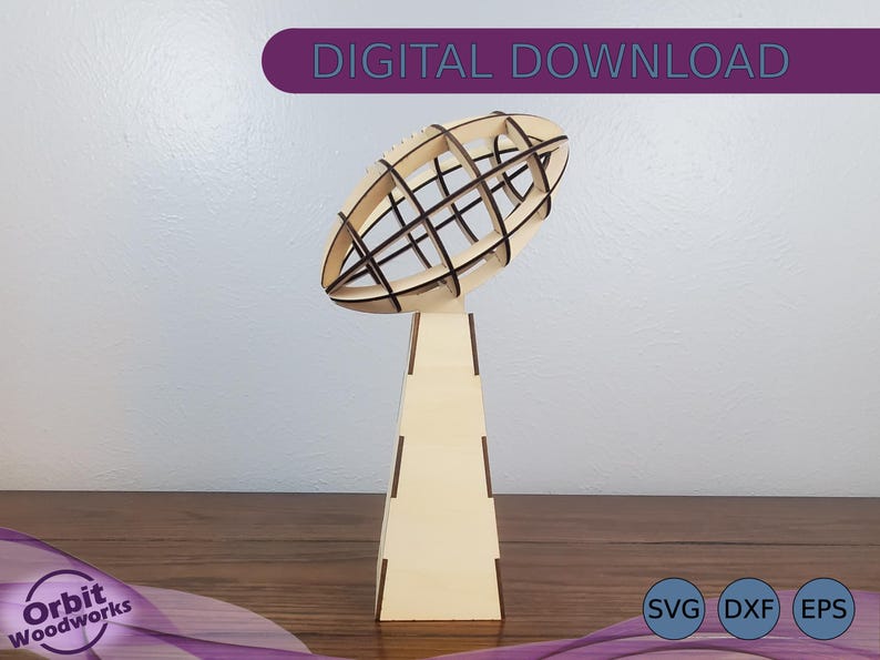 May include: A wooden trophy shaped like a football with a lattice design. The trophy is on a wooden base. The base is a square shape with a pointed top. The trophy is a digital download and comes in SVG, DXF, and EPS formats.