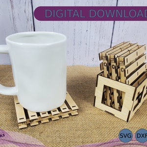 May include: A set of six wooden coasters with a pallet design, stacked in a wooden crate. The coasters are made of natural wood and have a rustic look. The crate is also made of wood and has a simple design. The coasters are perfect for adding a touch of rustic charm to any home.