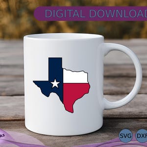 May include: White ceramic mug featuring the Texas state flag design. The flag is a split design with a blue section containing a white star, a white stripe, and a red stripe. The mug has a curved handle and the text "DIGITAL DOWNLOAD".