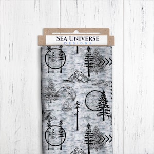 May include: A white fabric with a black and gray print of a camping scene. The print includes trees, a tent, a campfire, and a mountain. The fabric has the text "SEA UNIVERSE DESIGNS" printed on it.