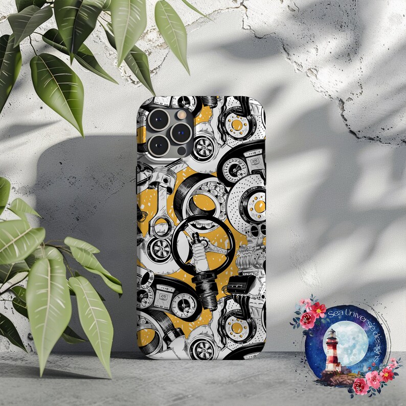 May include: A black and white phone case with a yellow background. The case features a pattern of car parts, including pistons, gears, and spark plugs.
