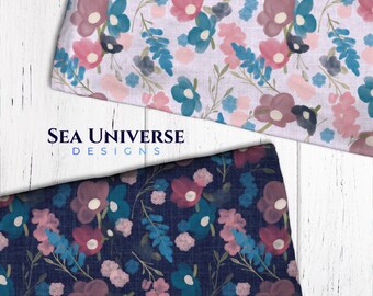 May include: Two fabric swatches with floral patterns. The top swatch has a light pink background with blue and pink flowers. The bottom swatch has a dark blue background with pink and blue flowers. The text "SEA UNIVERSE DESIGNS" is visible on the top swatch.