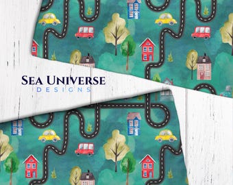 May include: A seamless pattern featuring a whimsical town with houses, trees, cars, and winding roads. The design is rendered in watercolor on a teal background.