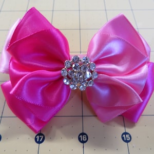 Sparkling Pink Bow Clip - Two-Tone Attire Accessory with Gemstone Elegance