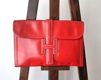 Hermès Jige Clutch aus rotem Leder und beigem Stoff