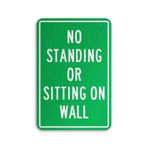 No Standing Sign, No Standing Or Sitting On Wall Sign