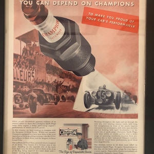 Framed Vintage 1938 Champion Sparkplugs Advertisement- ‘’Victory at LeMans’’