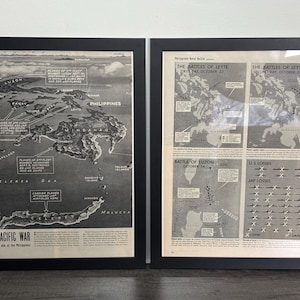 May include: Two framed black and white prints. The left print features a map of the Philippines with text that reads "THE PACIFIC WAR". The right print shows maps and text about the Battles of Leyte and Luzon.