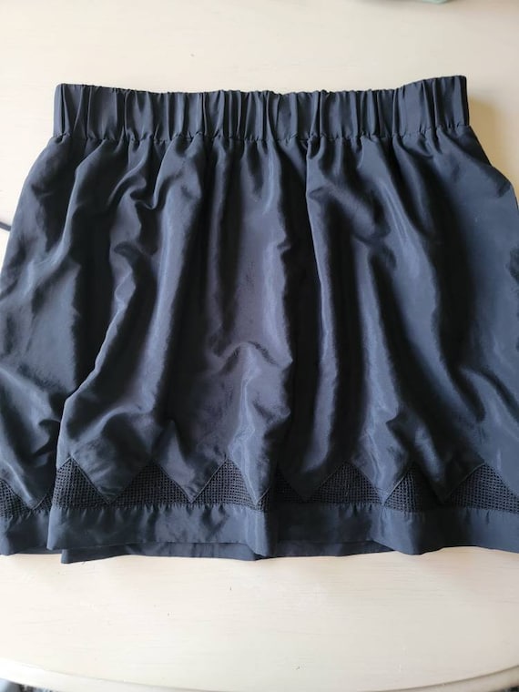 Perfect little black skirt with cut out details. A