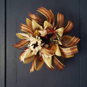 Fall door wreath in warm color scheme fake flowers, foliage & butterfliy and deco mesh accents. Elegant Rustic farmhouse/ bohemian decor.