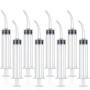 May include: A collection of clear plastic syringes with curved tips. Each syringe has a black and gray band near the top and a plunger at the base. The syringes are arranged in a row against a white background.