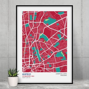 Peut inclure: Une carte rouge et blanche d'Anfield, Liverpool, Angleterre. La carte montre les rues et les parcs du quartier. Le texte "Anfield Established 1884 53.43° N 2.94° W" est en bas de la carte.