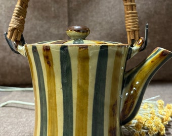 Whimsical striped teapot with wicker handle. 1970’s Vintage