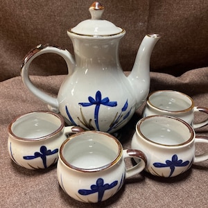 Beautiful Japanese Blue Floral Tea Set with earth tone accents. 7 pieces: pot, creamer, sugar bowl, and 4 cups.