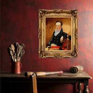 May include: A framed oil painting of a man in a dark suit and white cravat, sitting in a red chair with a book in his lap. The painting is set against a red wall with a wooden table and other objects in the foreground.