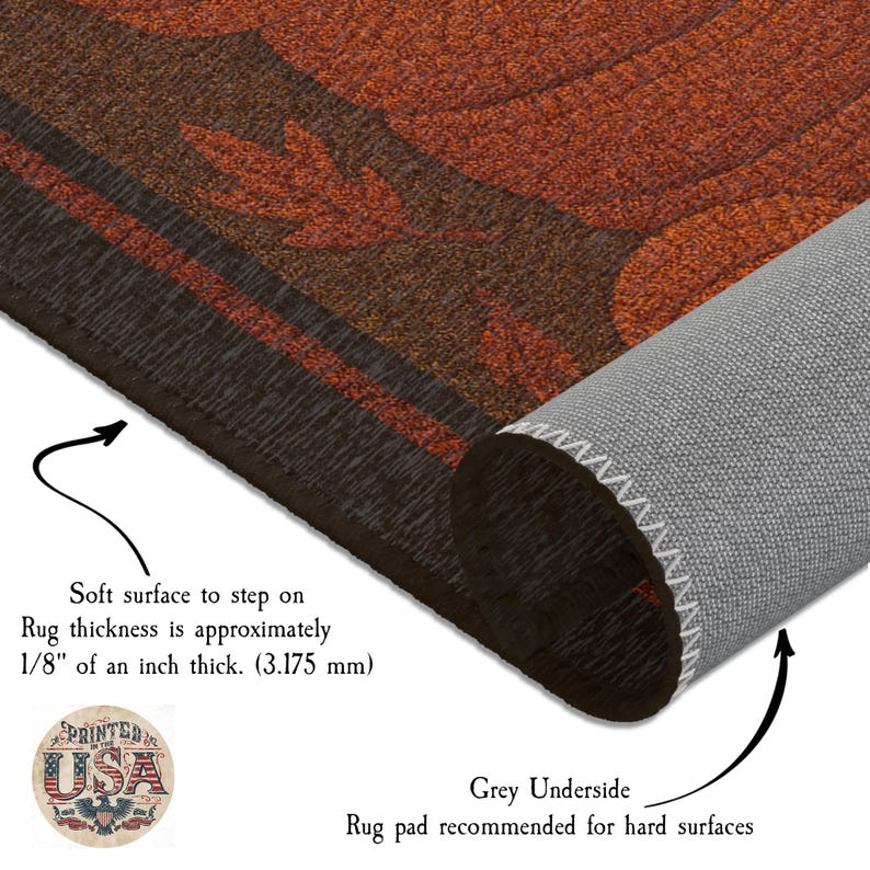 May include: A rolled-up brown and orange rug with a leaf design. The rug has a soft surface and is approximately 1/8 inch thick. The underside is gray. The rug is recommended for hard surfaces.