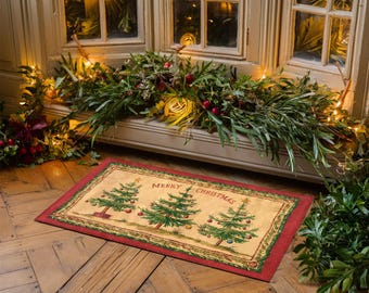 May include: A beige doormat with a red border features a festive design of three stylised Christmas trees with ornaments and the text "Merry Christmas".