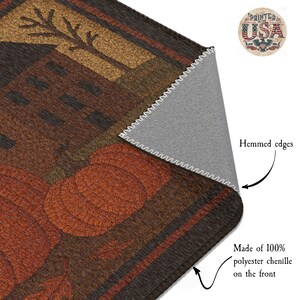 May include: A rectangular, fall-themed rug with a pumpkin design in shades of orange, brown, and gold. The rug is made of 100% polyester chenille and has hemmed edges. The design includes a tree and a house.