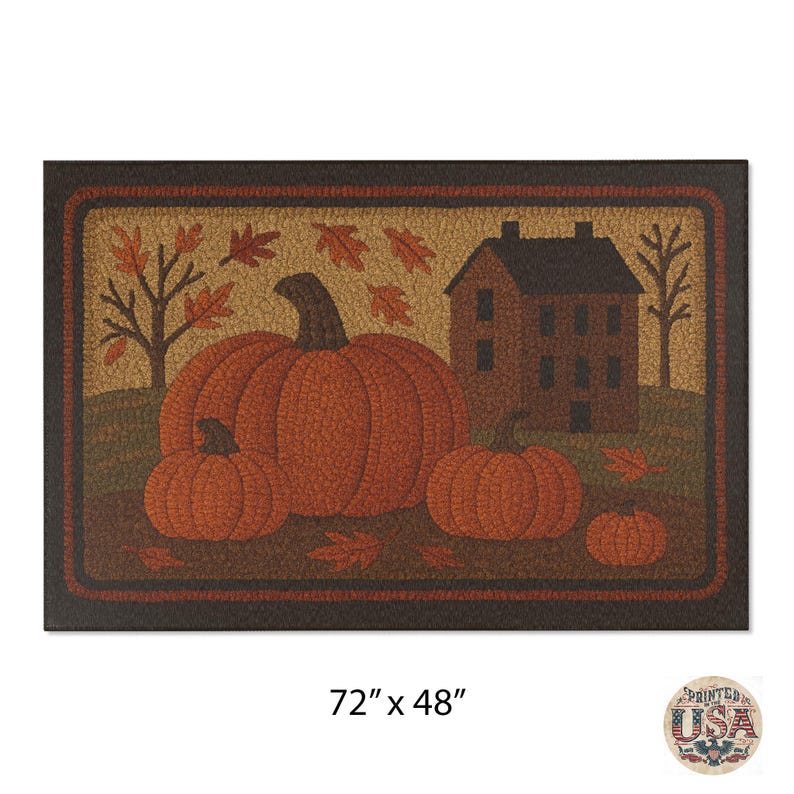 May include: Rectangular doormat featuring a fall harvest scene. The mat displays a large orange pumpkin with smaller pumpkins, a house, and autumn leaves. The mat measures 72 inches by 48 inches.