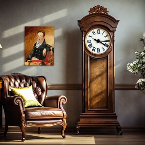 May include: A brown leather armchair with a green pillow sits in a room with a tall wooden grandfather clock and a painting of a man in a black coat. The clock has a white face with black Roman numerals and hands.