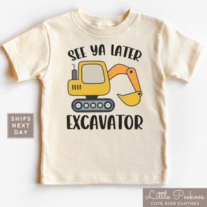 May include: A beige toddler t-shirt with a yellow excavator graphic and the text "See ya later Excavator".