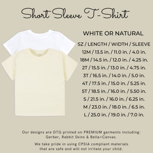 May include: Two short-sleeve t-shirts, one white and one natural, are displayed. The image includes a size chart with measurements in inches for length, width, and sleeve. The text reads "Short Sleeve T-Shirt" and details about the garment's materials.