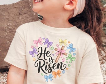 He is Risen Faith Based Kids Tshirt - Coquette Easter Sunday Shirt - Girls Easter Sunday Youth Tee - Jesus Resurrection Natural Toddler Tee