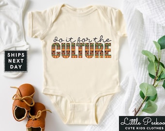 May include: A cream-colored baby onesie with short sleeves features the text "Do it for the CULTURE" in bold, colorful letters with a geometric pattern.