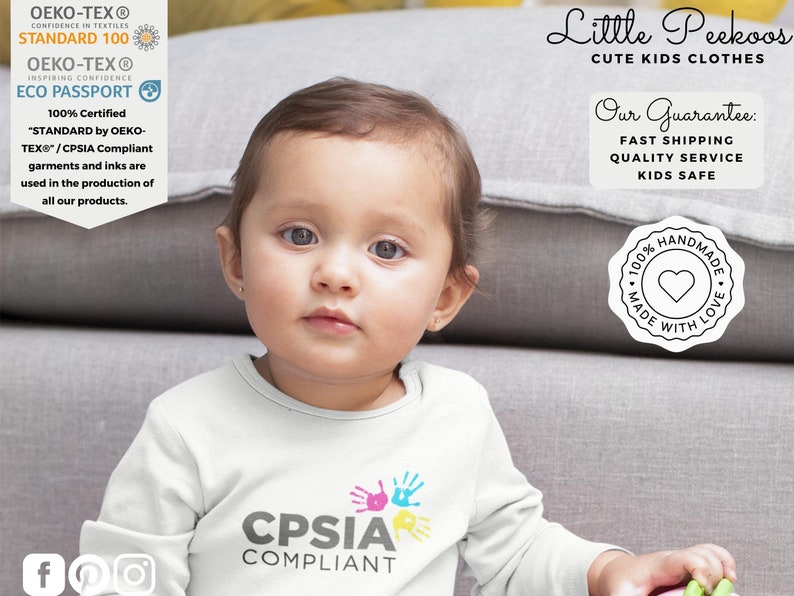 May include: A white long-sleeve shirt with a colorful handprint design and the text "CPSIA COMPLIANT". The shirt is made with 100% certified OEKO-TEX Standard 100 and CPSIA compliant materials. The image also includes a stamp that says "100% HANDMADE MADE WITH LOVE".