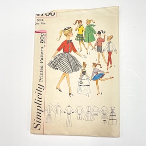 May include: Vintage Simplicity doll pattern featuring illustrations of dolls in various outfits. The pattern cover has a cream background with the text "Simplicity Printed Pattern" and "50c". The illustrations include a red top with a black and white skirt, a yellow top with a green skirt, and more.