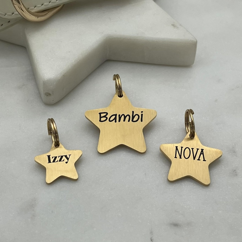 A collection of 3 sizes of stainless steel star shaped pet id tags. 
in 18k gold pvd coating with a brushed finish. personalized dog tags,
choose from several fonts.
precisely laser engraved in house by sunset pet tags.
made in the usa with 316 surgical stainless steel.