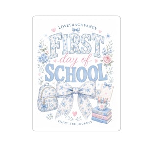 May include: A rectangular sign featuring the text LOVESHACKFANCY FIRST day of SCHOOL ENJOY THE JOURNEY. The design includes a blue floral backpack, a large blue floral bow, a notepad, a cup with pencils, and three books labeled DREAM LEARN GROW.