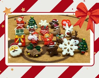 May include: A collection of small, colorful Christmas-themed resin buttons featuring various shapes including Santa Claus, a green Christmas tree, white snowflakes, a brown gingerbread man, a red angel, a reindeer, bells, and a gift box.