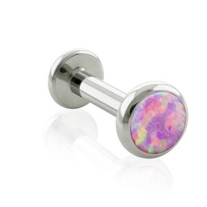 May include: A silver-toned labret stud body jewelry piece featuring a flat circular back and a front setting containing a round, iridescent cabochon stone with vibrant pink, purple, and light blue color shifts throughout the surface.