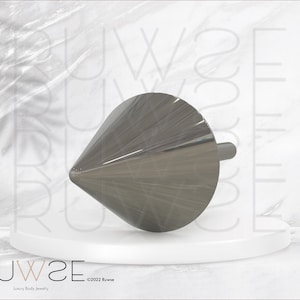 May include: A polished, silver-toned metal body jewelry piece shaped like a cone with a flat circular base and a protruding cylindrical post. The object features a smooth, reflective surface and is positioned horizontally on a white circular platform.