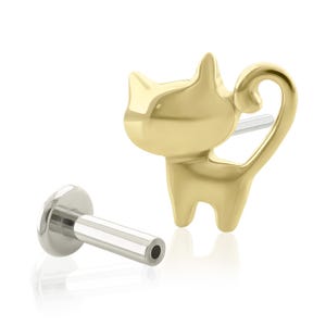 May include: A gold-toned cat-shaped stud earring with a smooth, polished finish. The design features a stylized feline silhouette with pointed ears and a curved tail. It includes a separate silver-toned flat-back post with a circular base.