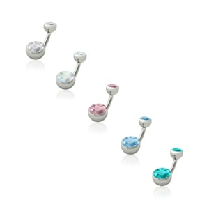 May include: Five belly button rings with different colored gems. The gems are clear, light blue, pink, blue, and teal.