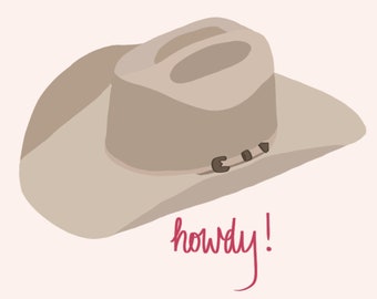 Può includere: Un cappello da cowboy beige con una fascia marrone e la parola "howdy!" scritta in rosa sotto.
