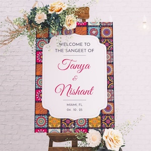 May include: Welcome to the Sangeet of Tanya & Nishant, a wedding sign with a colorful patterned border, in Miami, FL on 04.10.25.