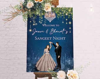 May include: A blue and gold welcome sign with a couple dancing in front of a chandelier. The sign reads "Welcome to Janvi & Bharat's Sangeet Night".