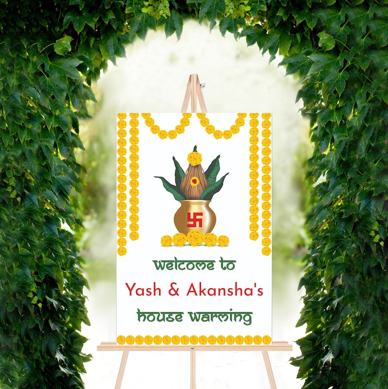 May include: A white welcome sign with yellow floral garlands, a gold pot with a green plant, and the text "welcome to Yash & Akansha's house warming".