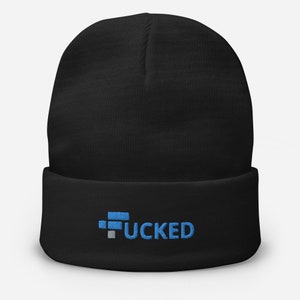 May include: Black beanie with the word "FUCKED" embroidered in blue and gray. The beanie is a classic, cuffed style, perfect for cold weather. The text is in a bold, sans-serif font.