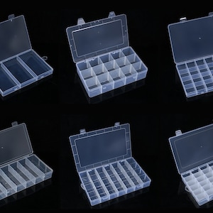 May include: Six clear plastic storage boxes with lids. The boxes have different compartment configurations, including three, six, twelve, and twenty-four compartments.