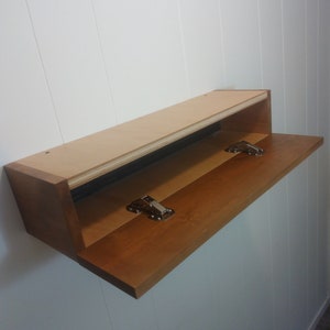 Floating shelf with storage space.