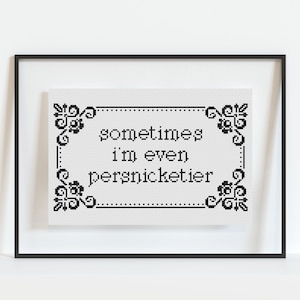 May include: Black and white cross-stitch embroidery framed in a black frame. The embroidery reads "sometimes i'm even persnicktier".