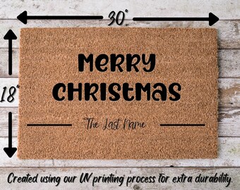 May include: A brown coir doormat with the text "Merry Christmas" and a blank line for a last name. The doormat measures 30 inches by 18 inches.