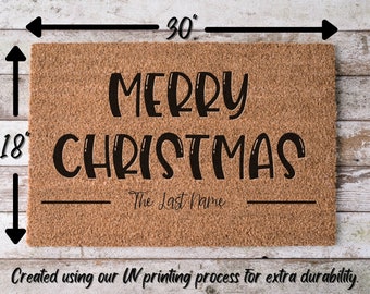 May include: A brown coir doormat with the text "Merry Christmas The Last Name" in black lettering. The doormat measures 30 inches by 18 inches.