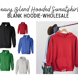 May include: A selection of blank hooded sweatshirts in various colors, including black, red, blue, green, and gray. The image also features a red hoodie hanging on a rack. Text on the image reads "Heavy Blend Hooded Sweatshirt" and "BLANK HOODIE-WHOLESALE."
