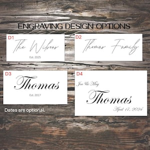 May include: Image showcasing engraving design options on a wooden background. The text "ENGRAVING DESIGN OPTIONS" is at the top. Four design options are displayed, each with names and dates, such as "The Wilsons Est. 2025" and "Thomas Family".